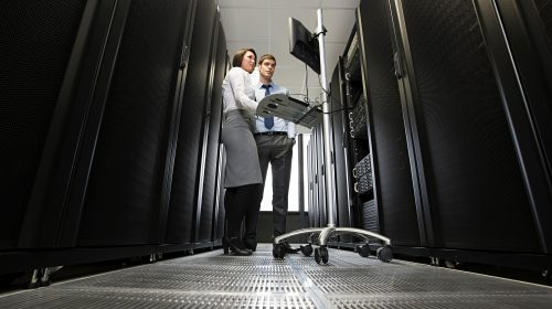 Professionals troubleshooting in a data center server room